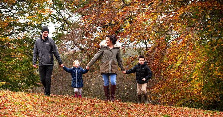 family of four enjoying an autumn walk in the Durham Dales